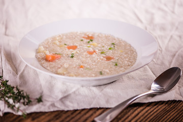 close up of a healthy taste barley soup with root vegetables