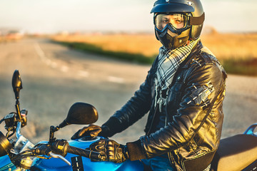 Man on sport motorcycle outdoor on the road