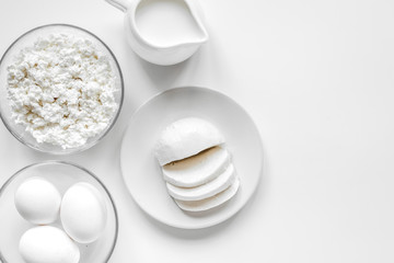 monochrome concept with dairy products on white table top view m