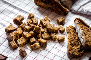traditional sliced bread with crumbs wooden table background