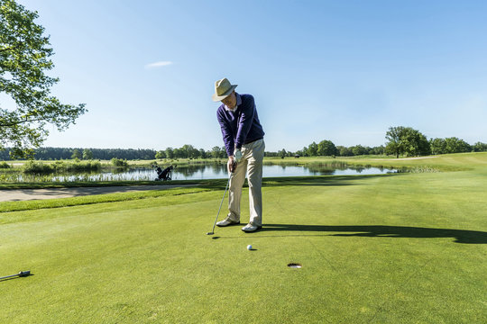 Senior man playing golf at a golf course