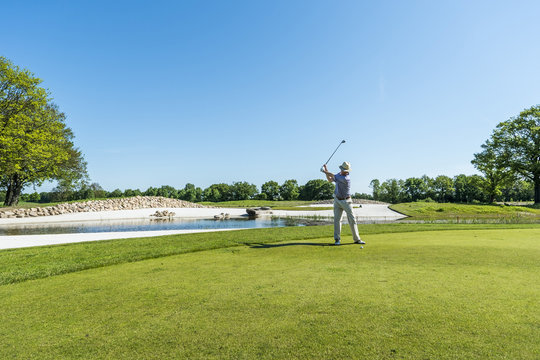 Mature man playing golf at a golf course