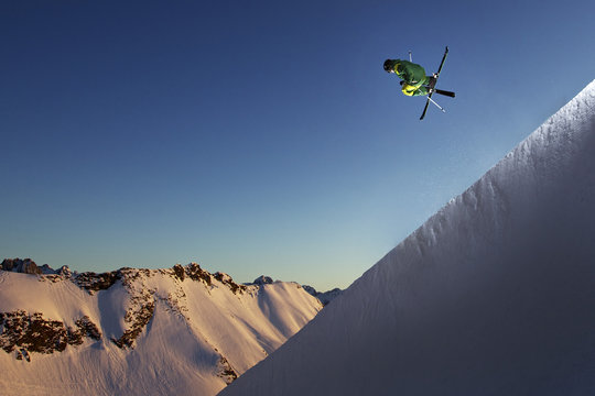 Freestyle skier jumping in a halfpipe, Nebelhorn, Allgau Alps, Bavaria, Germany