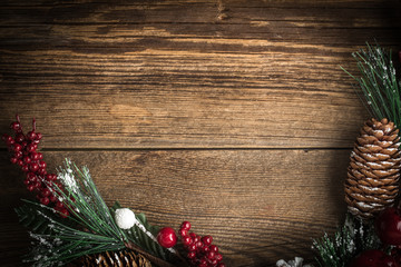 Christmas wooden background with cone and snow tree.