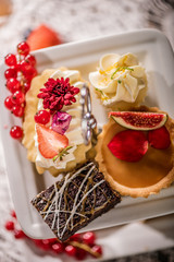 close up of a cream cake decorated with edible flowers