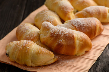 Homemade sweet croissants stuffed with cheese.