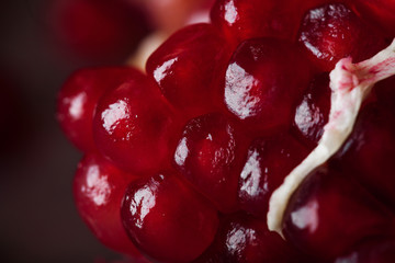 juicy fresh red pomegranate seeds on macro photography