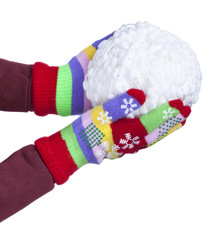 Snowball of white threads in child's hands, clad in colorful gloves isolated on white background, New Year, Christmas