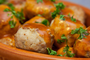 Homemade meatballs in tomato sauce with parsley