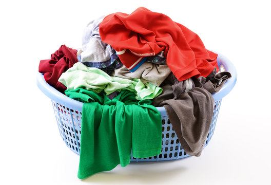 Clothes In A Laundry Basket Isolated On White Background