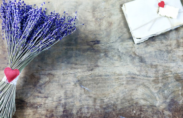 girl with a bouquet of lavender flowers on wooden table