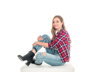 Obraz na płótnie Canvas girl in checkered shirt and jeans