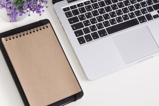 Laptop On A Desk With Stationery. Mockup For Decal, Sticker Design. Trendy Office, Freelance Workplace