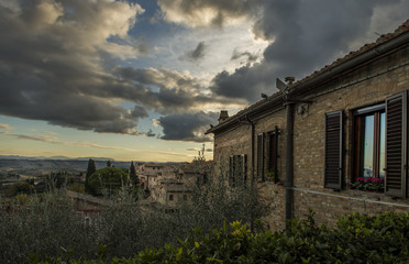 old architecture of San Gimignano, Italy on sunset