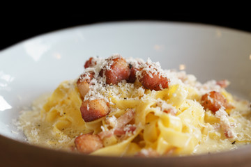 Linguine or spaghetti with cheese and pork bacon - italian food.
