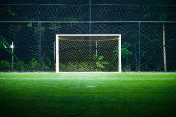 Indoor Football (soccer) Field with the Goal Post in the Night Time