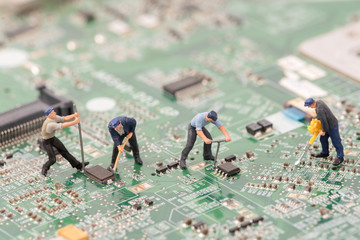 miniature people repair cpu board,teamwork and technology concept - obrazy, fototapety, plakaty