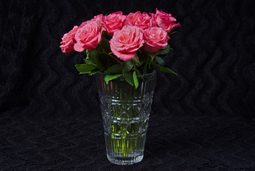 Bouquet of red roses in a glass vase