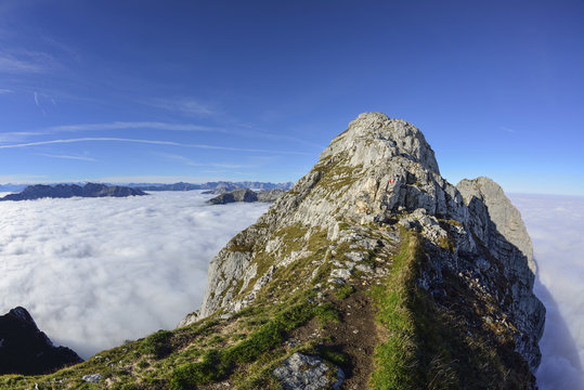 Path leading towards Guffert, sea of fog in the valley, Guffert, Rofan range, Tyrol, Austria