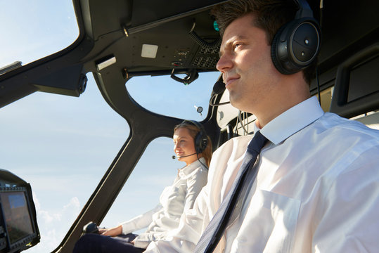 Pilot And Co Pilot In Cockpit Of Helicopter