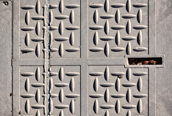Closeup of a gray utility street cover