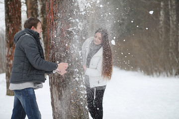 pair of lovers on a date winter afternoon in a snow blizzard