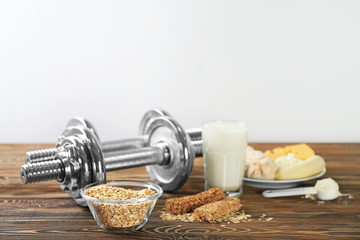 High protein food and powder on wooden table