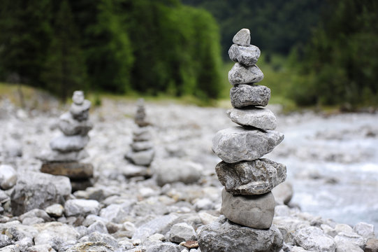 Stone cairns near the river at Hinterriss Eng, Karwendel mountains, Tyrolese limestone alps, Tirol, Austria