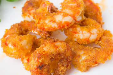 Fried prawns on a white background. Prawns fried in breading close-up.