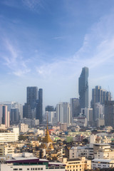 Fototapeta na wymiar skyline of Bangkok city with blue sky background, Bangkok city is modern metropolis of Thailand and favorite of tourists.