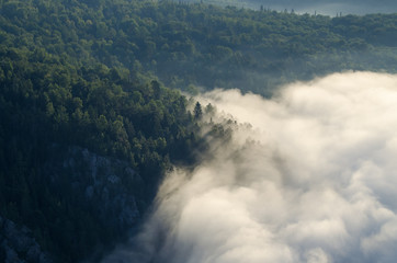 Clouds (Fog) Enveloping Mountains With Forest. Landscape. Sunrise. View From The Karatash Ridge. Russia, Ural, Bashkortostan, Aygir.