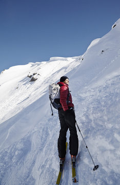 Woman ski touring in Villgraten Valley, Hohe Tauern, East Tyrol, Austria