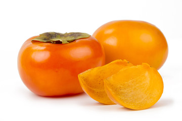 Fototapeta na wymiar Fresh persimmon fruit on isolated white background