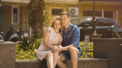 Sweet romantic couple hugging, enjoying date in summer park, happy people