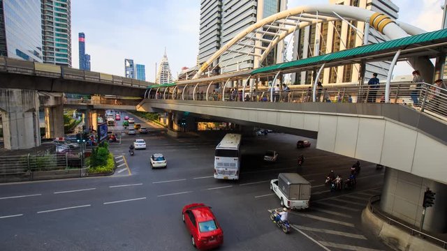 4k Time-lapse of public sky walk and traffic at Chong Nonsi sky train station, Bangkok, Thailand