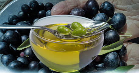 olives oil leaf spoon bowl food background