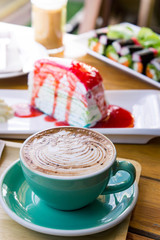 coffee mocha lattee cup on wood table and cake relax time on cafe shop