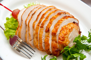 Chicken roll, beautifully sliced on a plate