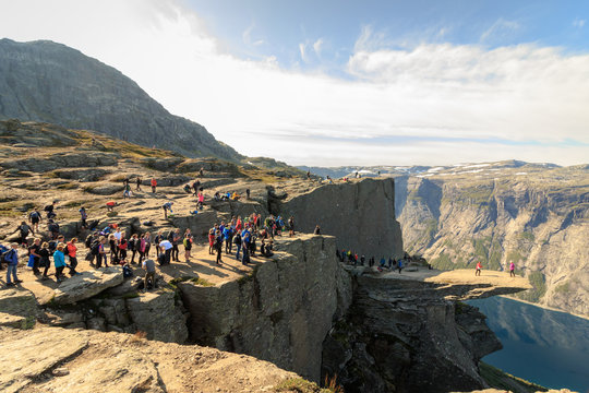Trolltunga, Norway - August 26, 2017: Many people waiting in a long line to get out on the Trolltunga for their photograph.