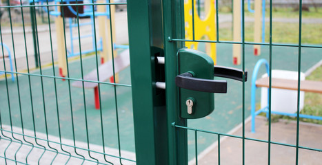 The door handle on the door, the street fence