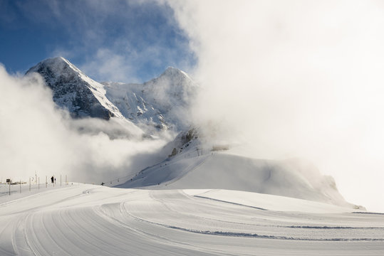 Ski area on Maennlichen mountain with Eiger Moench and Jungfrau in the background, Grindelwald, canton of Bern, Switzerland