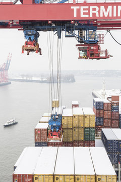 Loading and unloading of the container ship in the Container Terminal in Hamburg, Germany