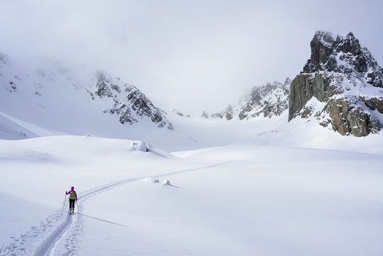 Female ski tourer ascending to Piz Sasuret, Piz Sasuret, Albula Alps, Engadin, Canton of Graubuenden, Switzerland