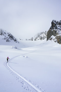 Female ski tourer ascending to Piz Sasuret, Piz Sasuret, Albula Alps, Engadin, Canton of Graubuenden, Switzerland