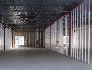 empty commercial space under construction metal studs horizontal