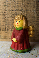 Christmas decoration, colorful angel girl candlelight in red