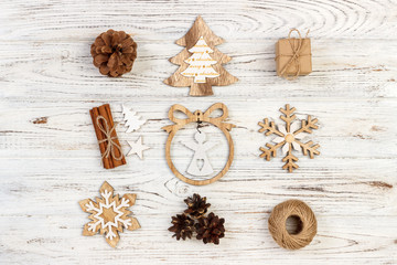Christmas composition. Gift, christmas decoration, snowflake, pine cones. Flat lay top view