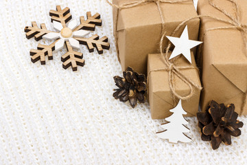 Christmas composition. Christmas gift, pine cones and star on white background
