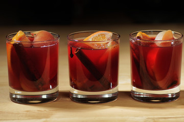 Hot wine drink. Warm Christmas wine. Mulled wine with oranges an