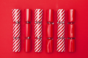Christmas crackers on a red background